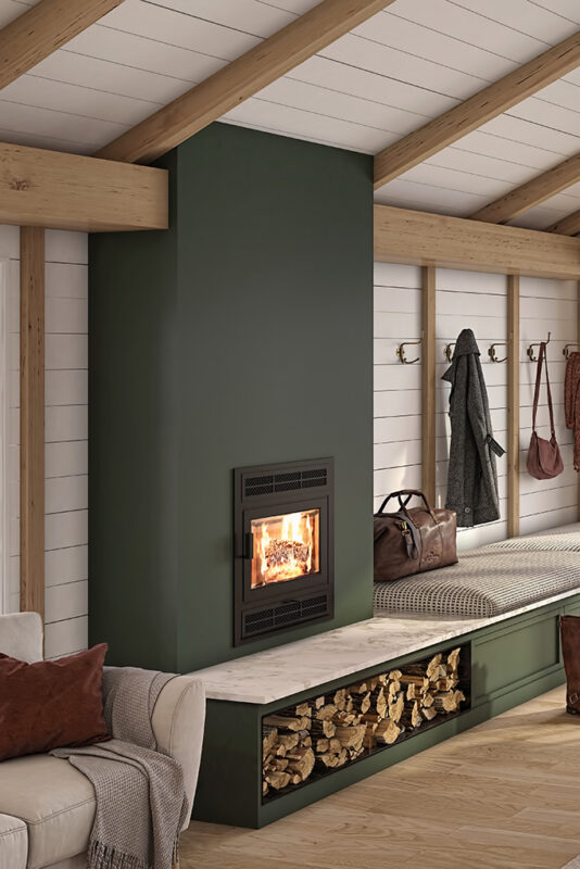 The Elegance® 30 Built-in Wood Burning Fireplace in a modern green cabin.