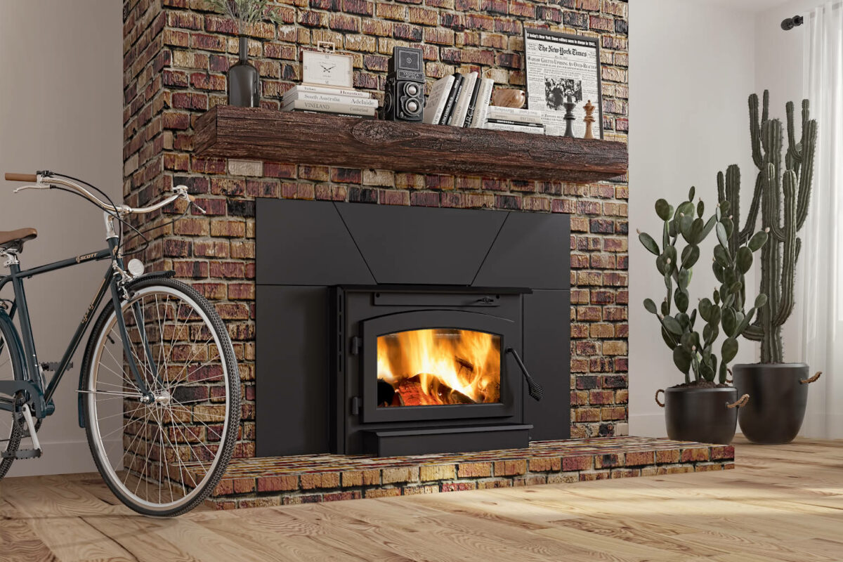 Outlander® 19i Wood Burning Fireplace Insert with a brick surround.